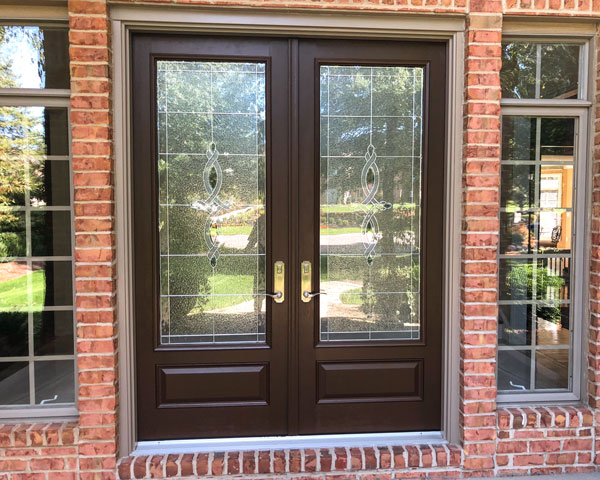 black french doors on brick house